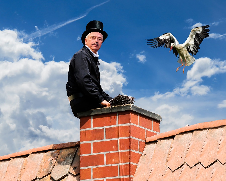 person cleaning chimney